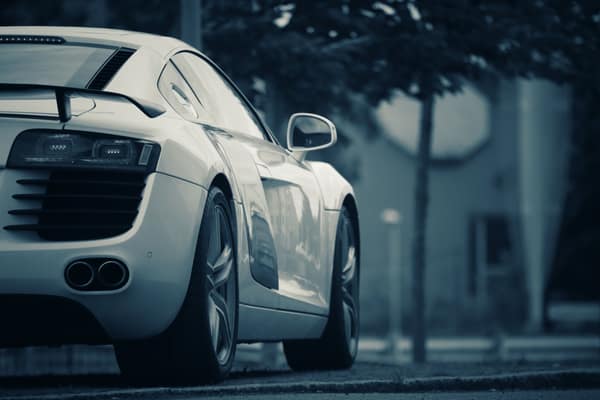 A luxury white sports car parked on a street in Jönköping, Sweden.