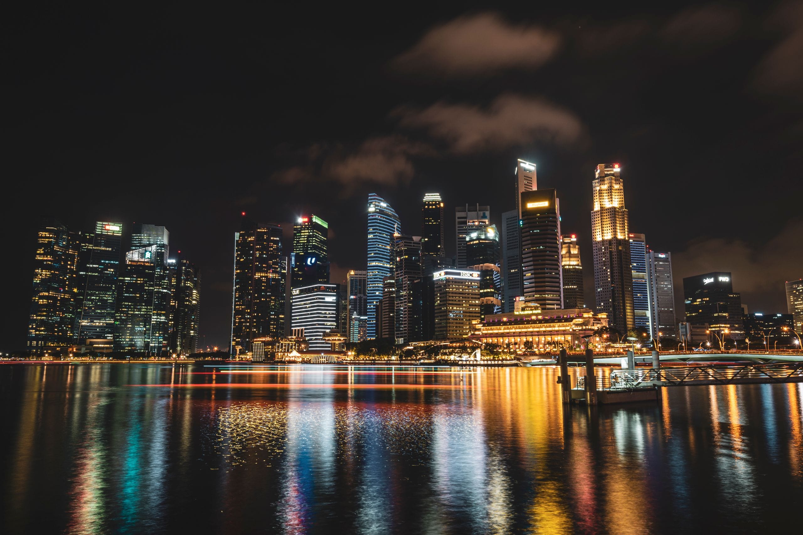 Dazzling night view of Singapore's illuminated skyline reflecting on w