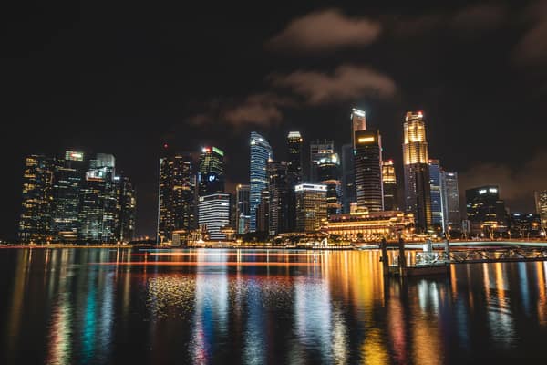Dazzling night view of Singapore's illuminated skyline reflecting on w
