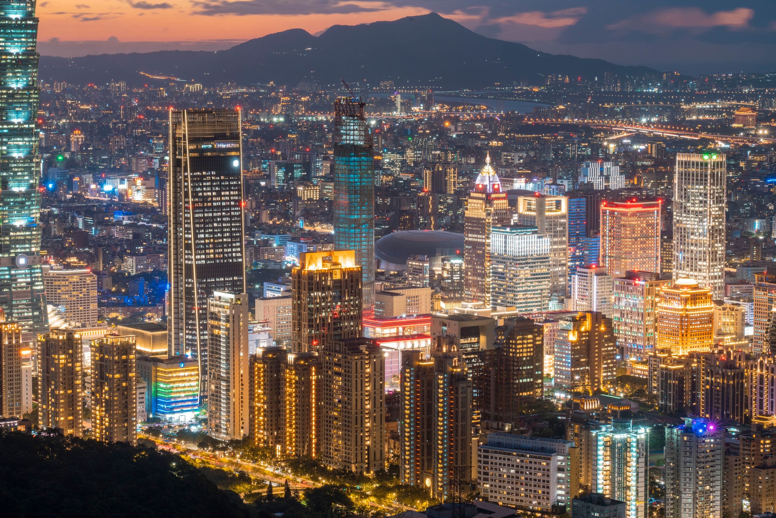 A stunning nighttime view of Taipei city, showcasing its illuminated s