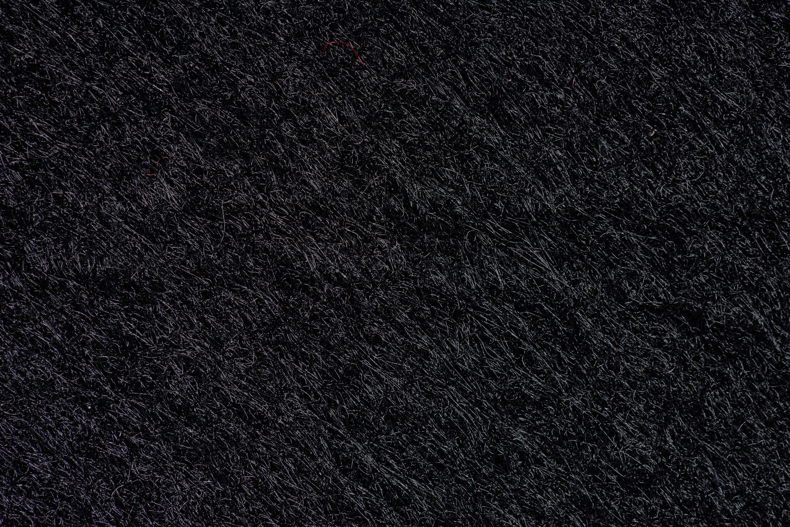 A detailed monochrome texture with dark, gritty pattern for background