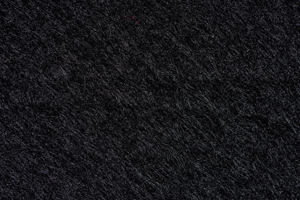 A detailed monochrome texture with dark, gritty pattern for background