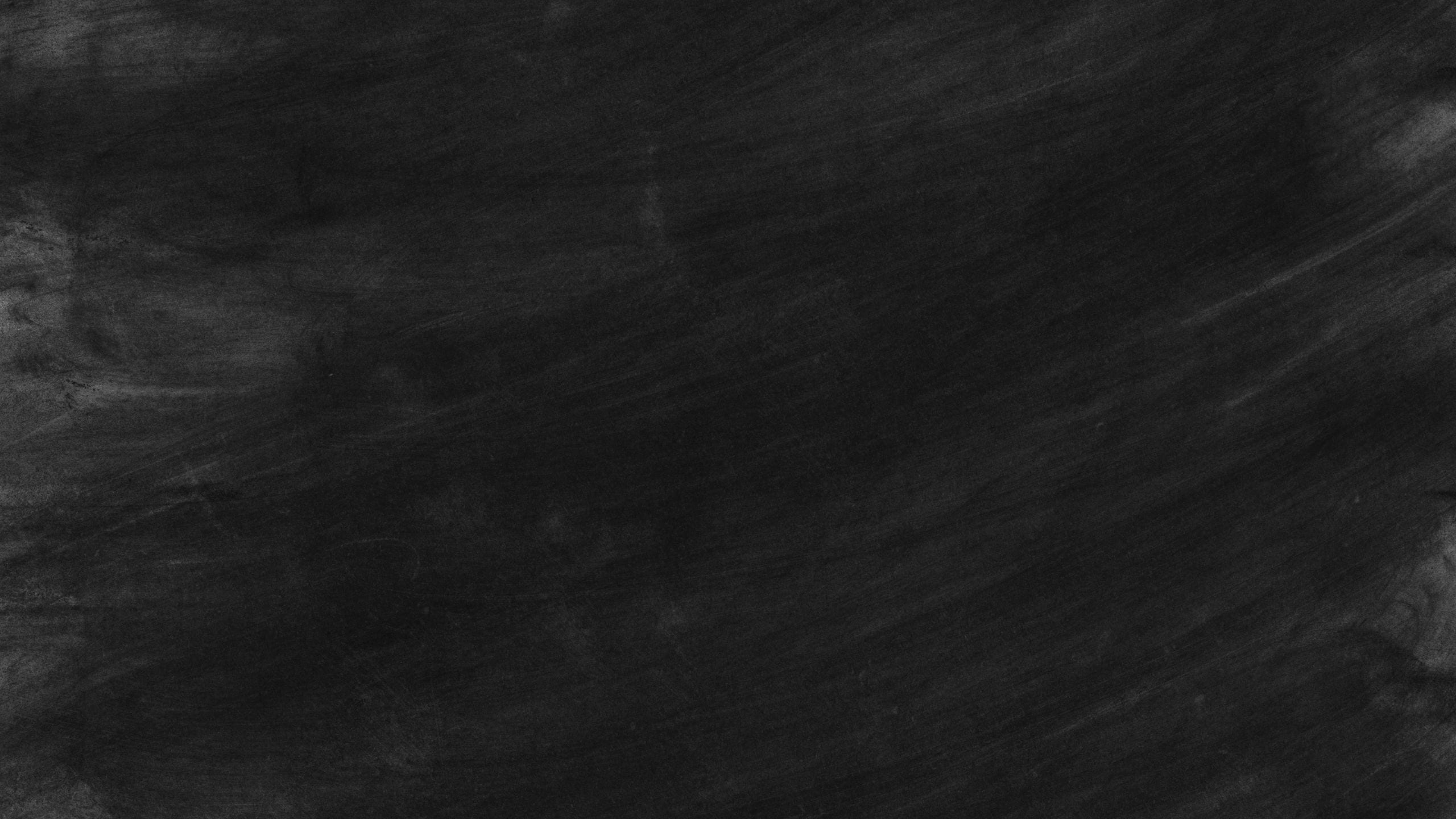 Black chalkboard with textured surface, perfect for educational themes