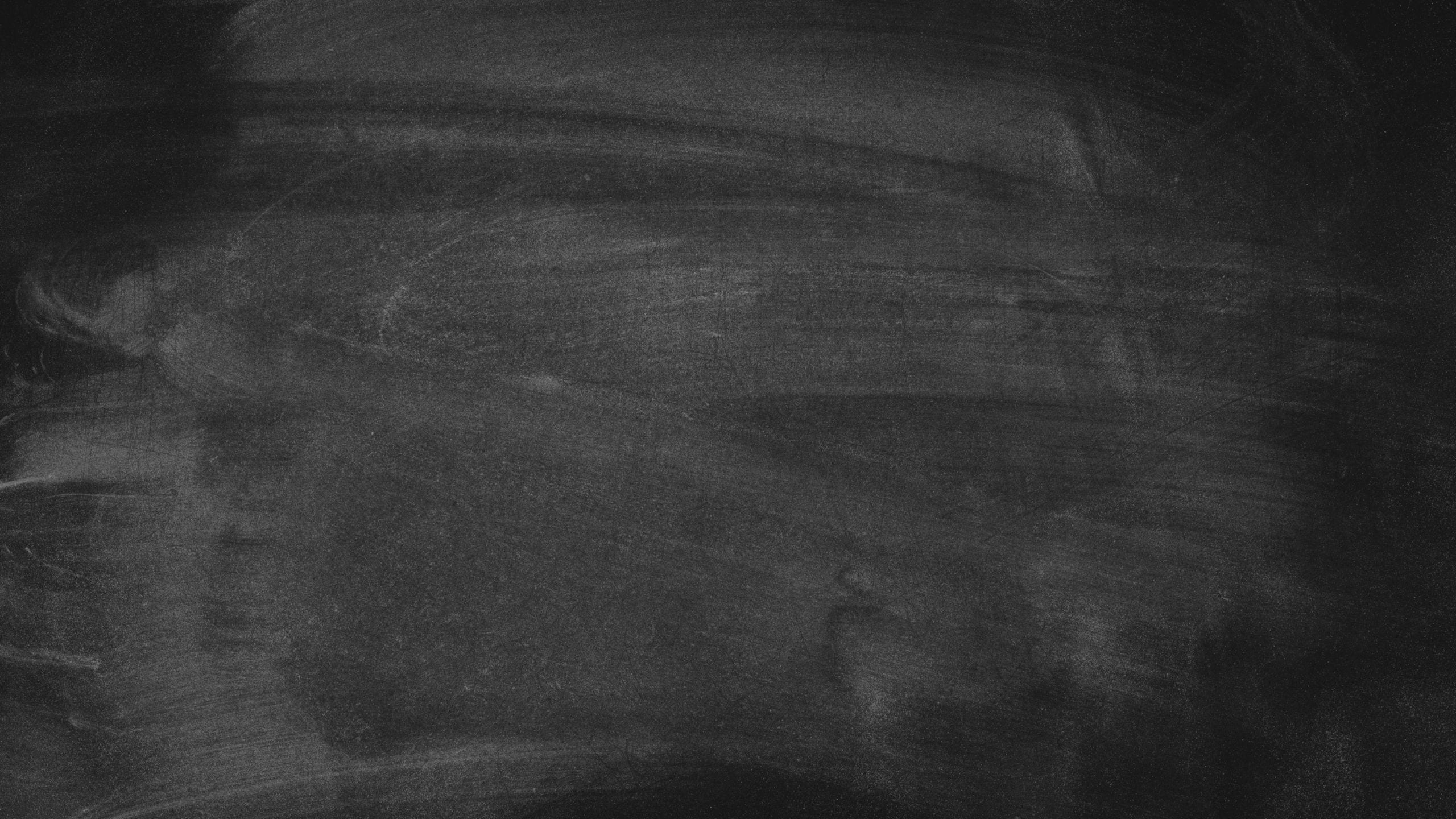 Dark textured chalkboard background suitable for design or educational