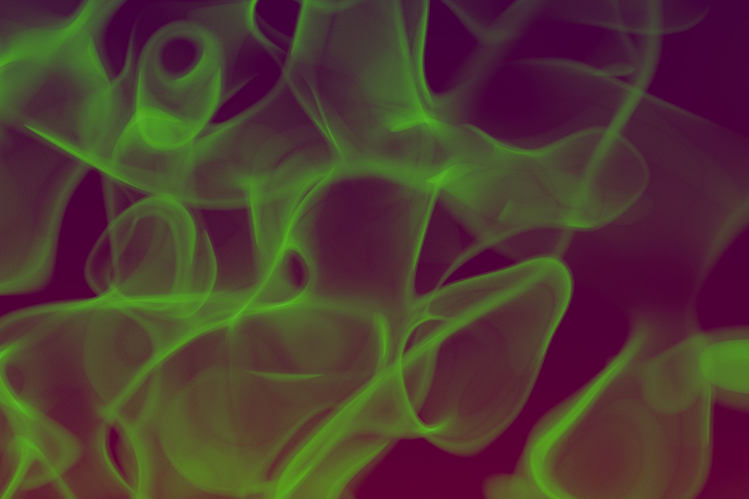 Colorful abstract art featuring swirling green smoke on a dark backgro