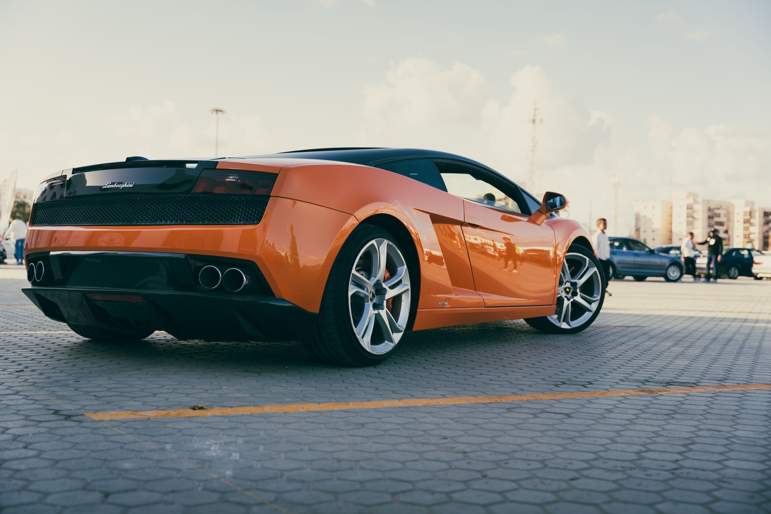 Vibrant orange Lamborghini Gallardo parked outdoors in Benghazi, Libya
