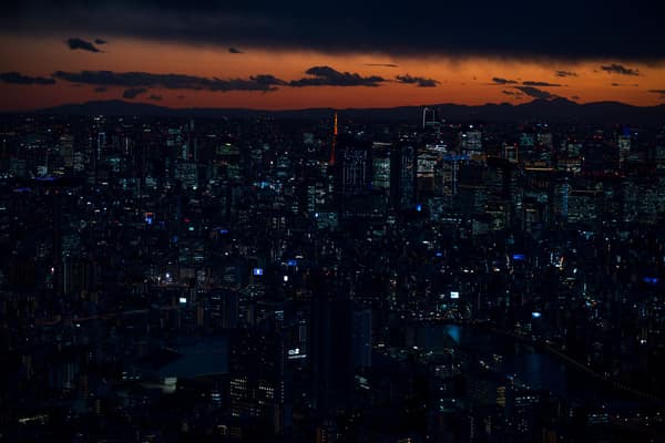 A stunning twilight view of Tokyo's vibrant cityscape featuring iconic