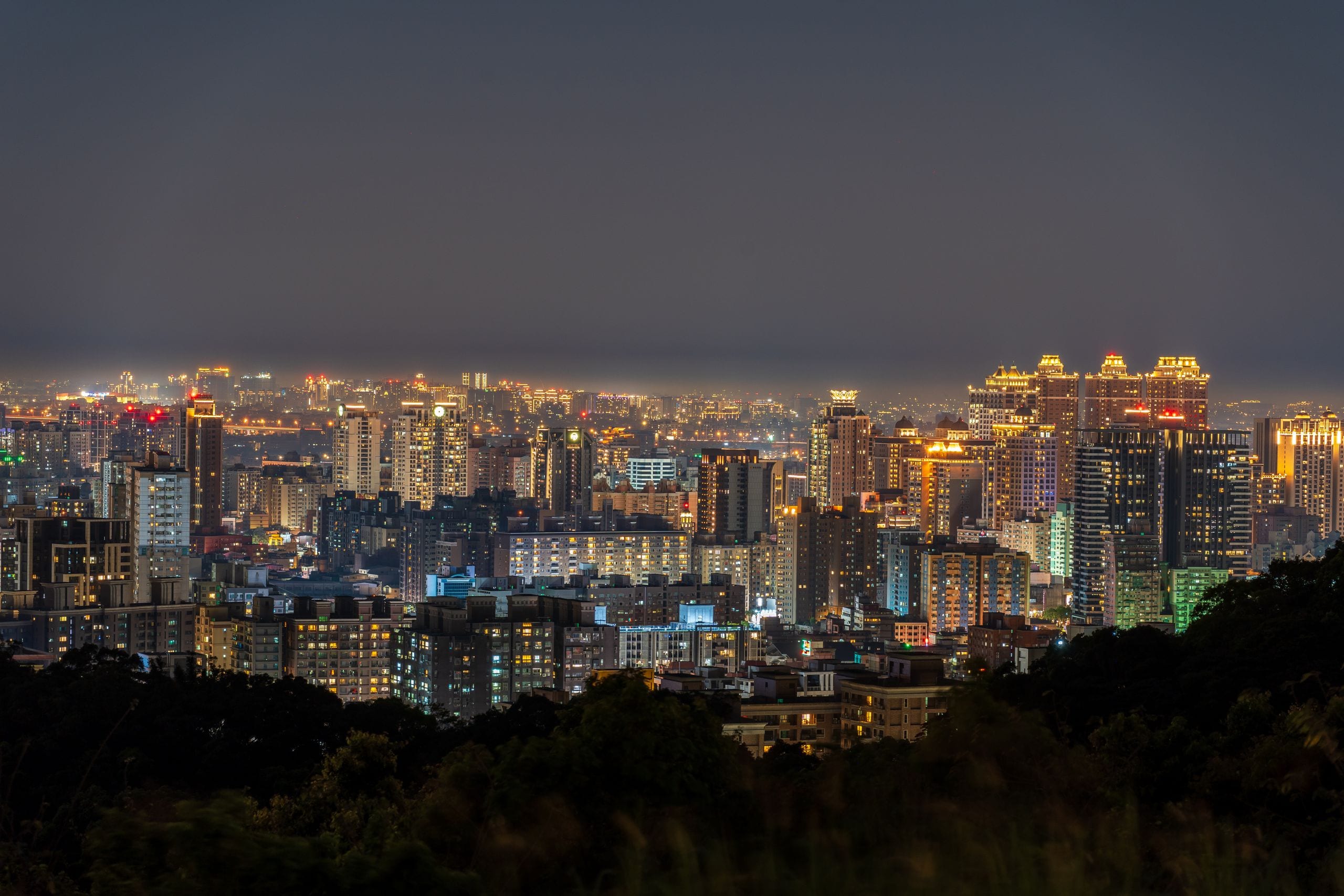 Stunning view of Taipei's skyline at night, showcasing illuminated sky
