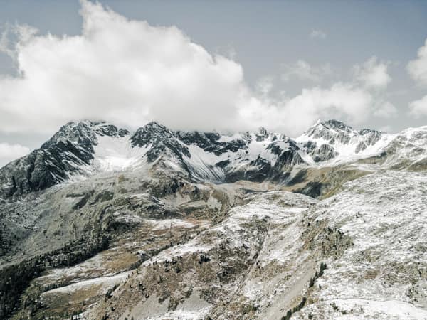 A stunning view of snow-covered mountains in Poschiavo, Switzerland, s