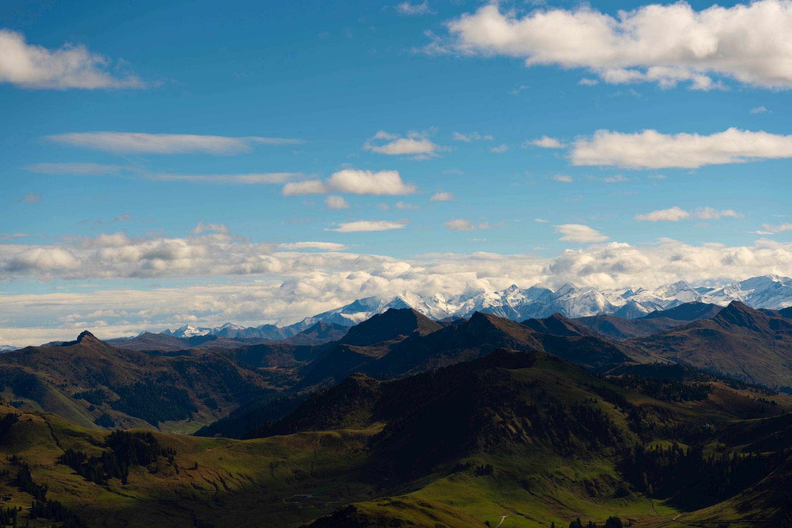 Majestic alpine mountains with snow peaks under a clear blue sky, perf