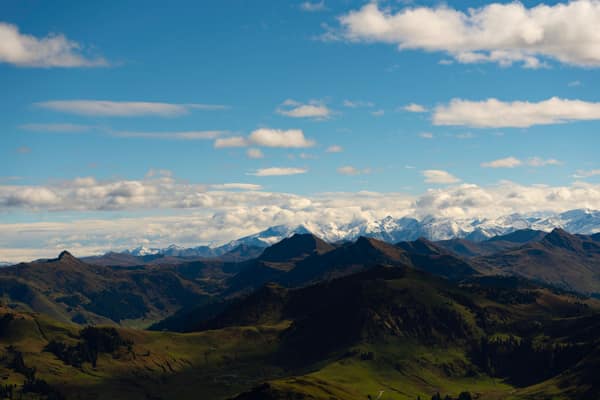Majestic alpine mountains with snow peaks under a clear blue sky, perf