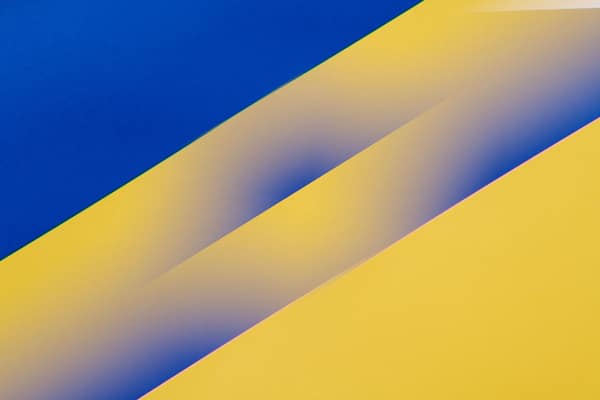 Vibrant blue and yellow diagonal abstract pattern design, perfect for 