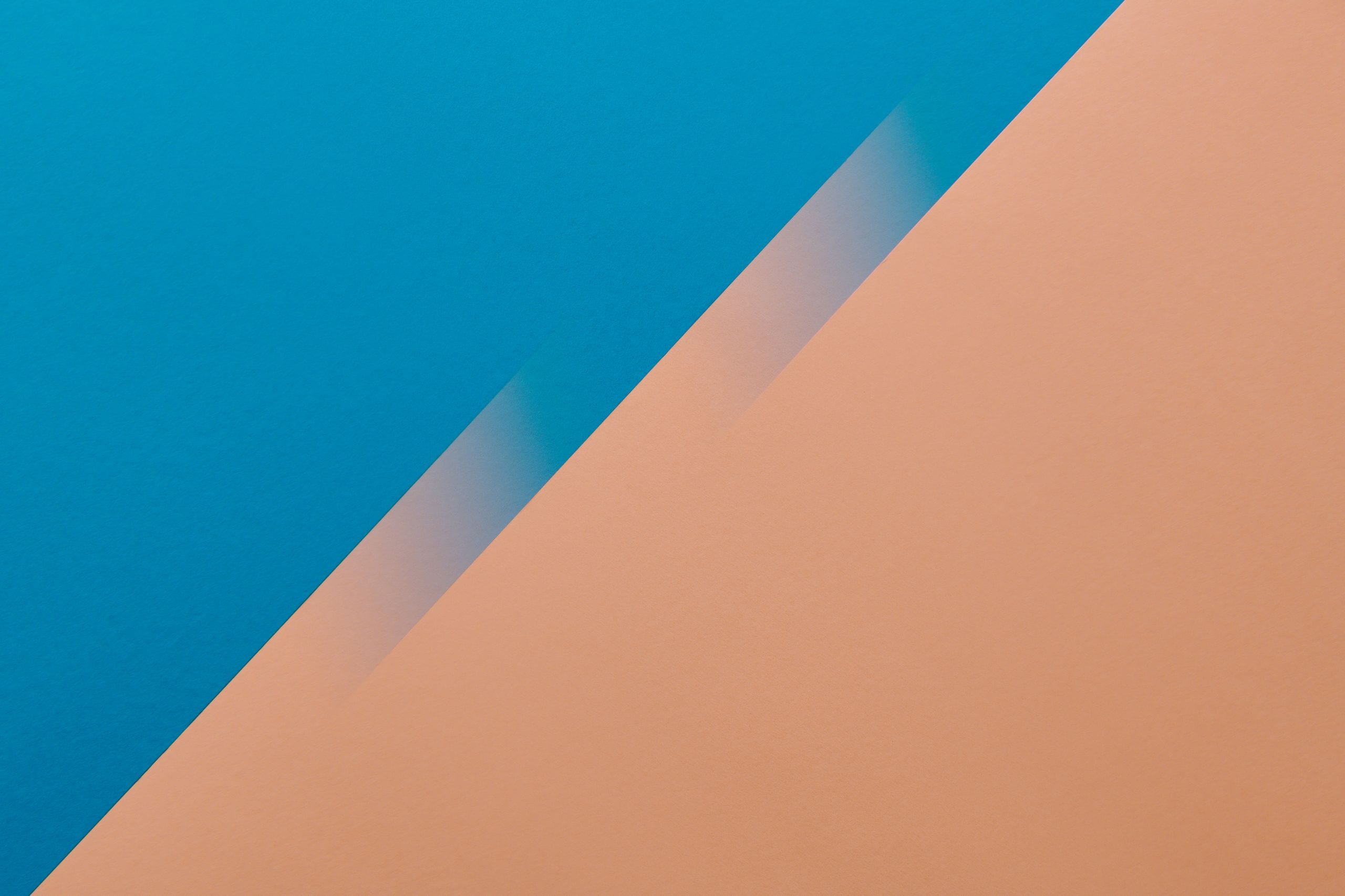 A vibrant abstract background featuring a bold blue and orange color g