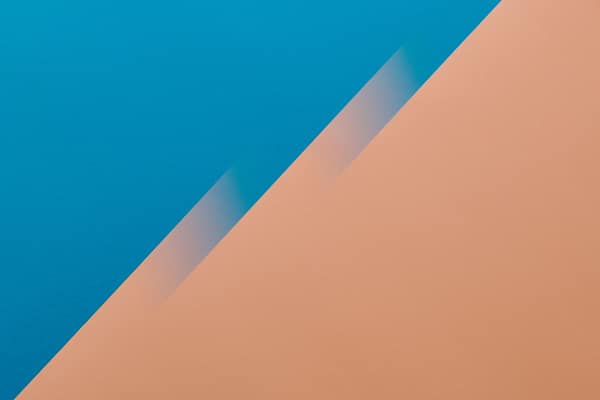 A vibrant abstract background featuring a bold blue and orange color g
