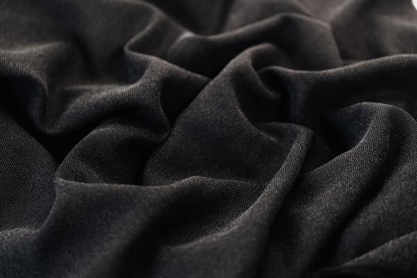 High-quality black fabric with intricate folds and texture, ideal for 
