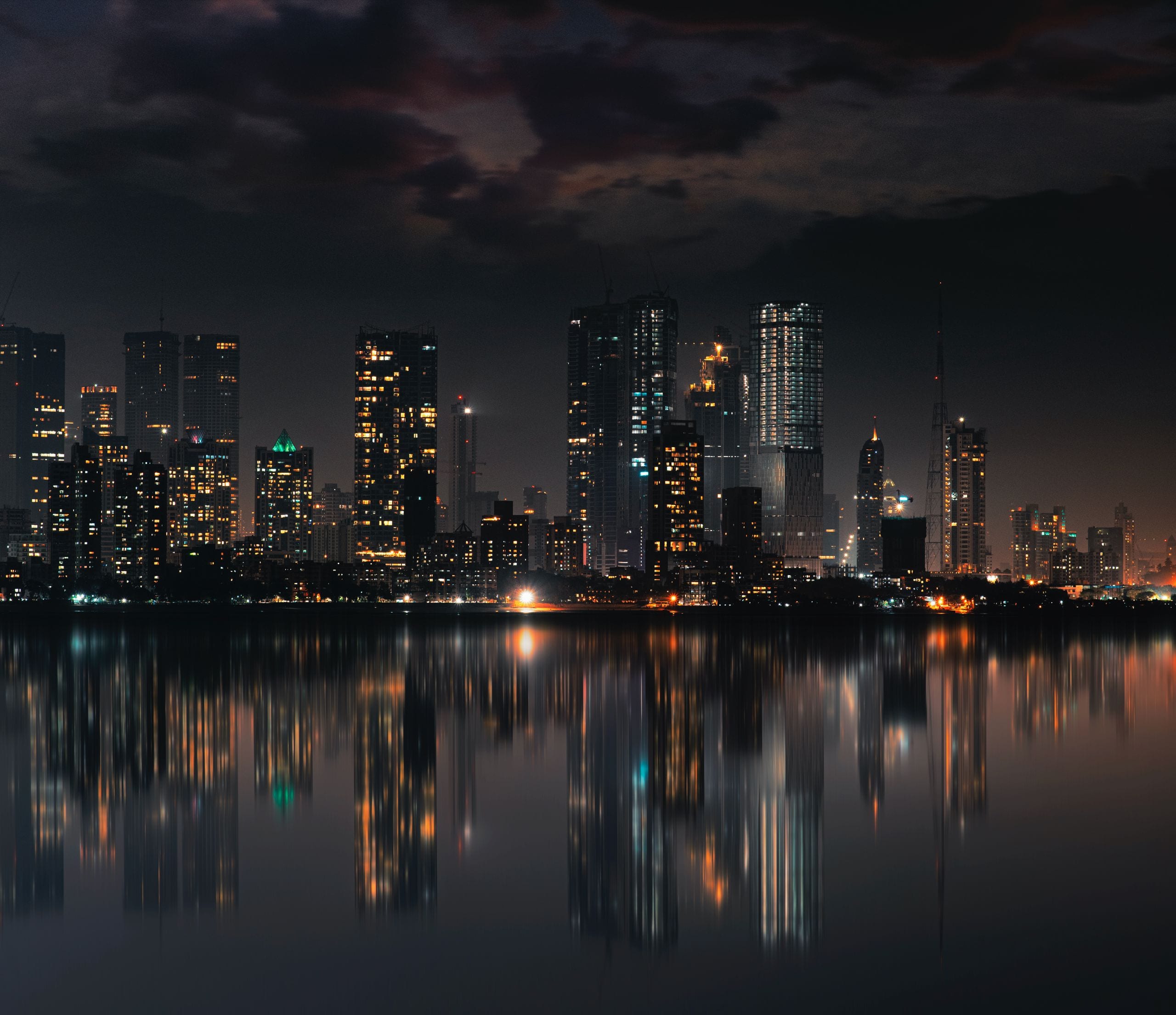 Captivating night view of Mumbai skyline with skyscrapers and reflecti