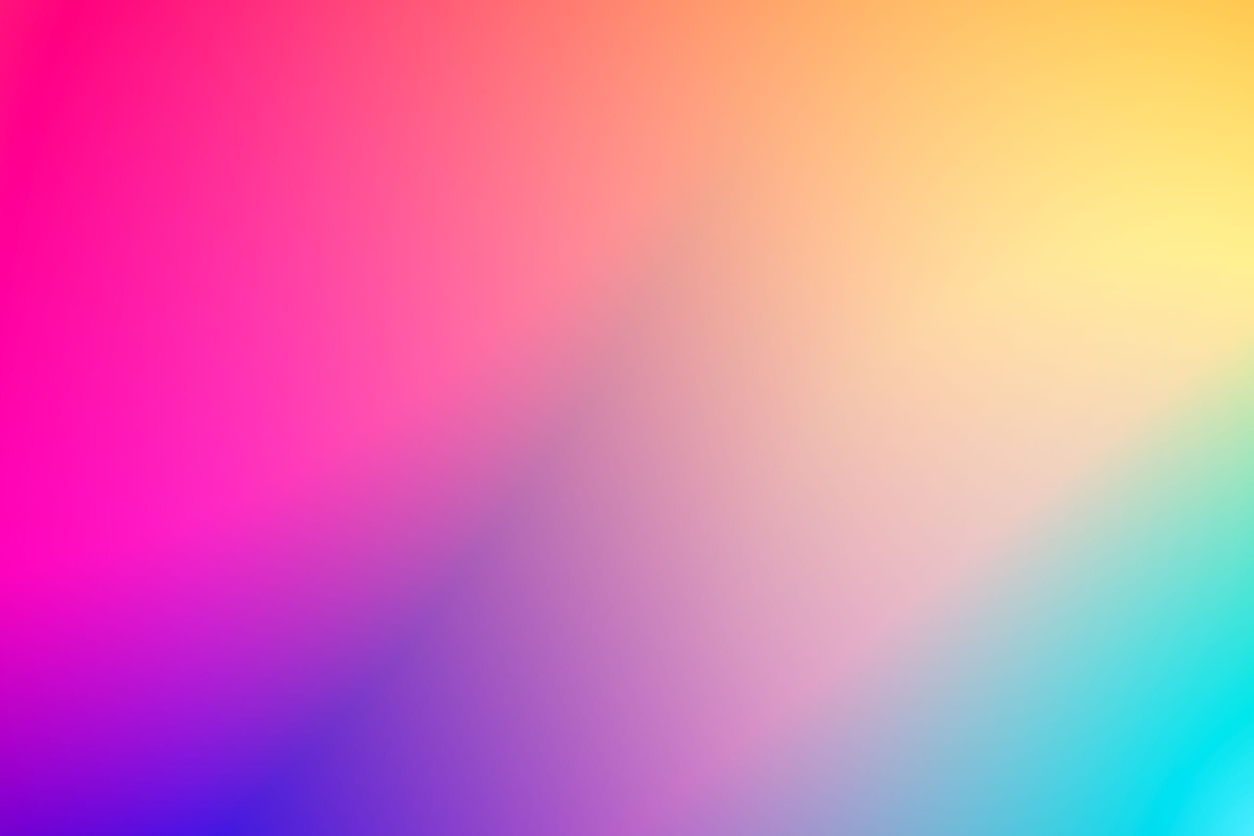 A seamless blend of vibrant pink and yellow hues in a smooth gradient,