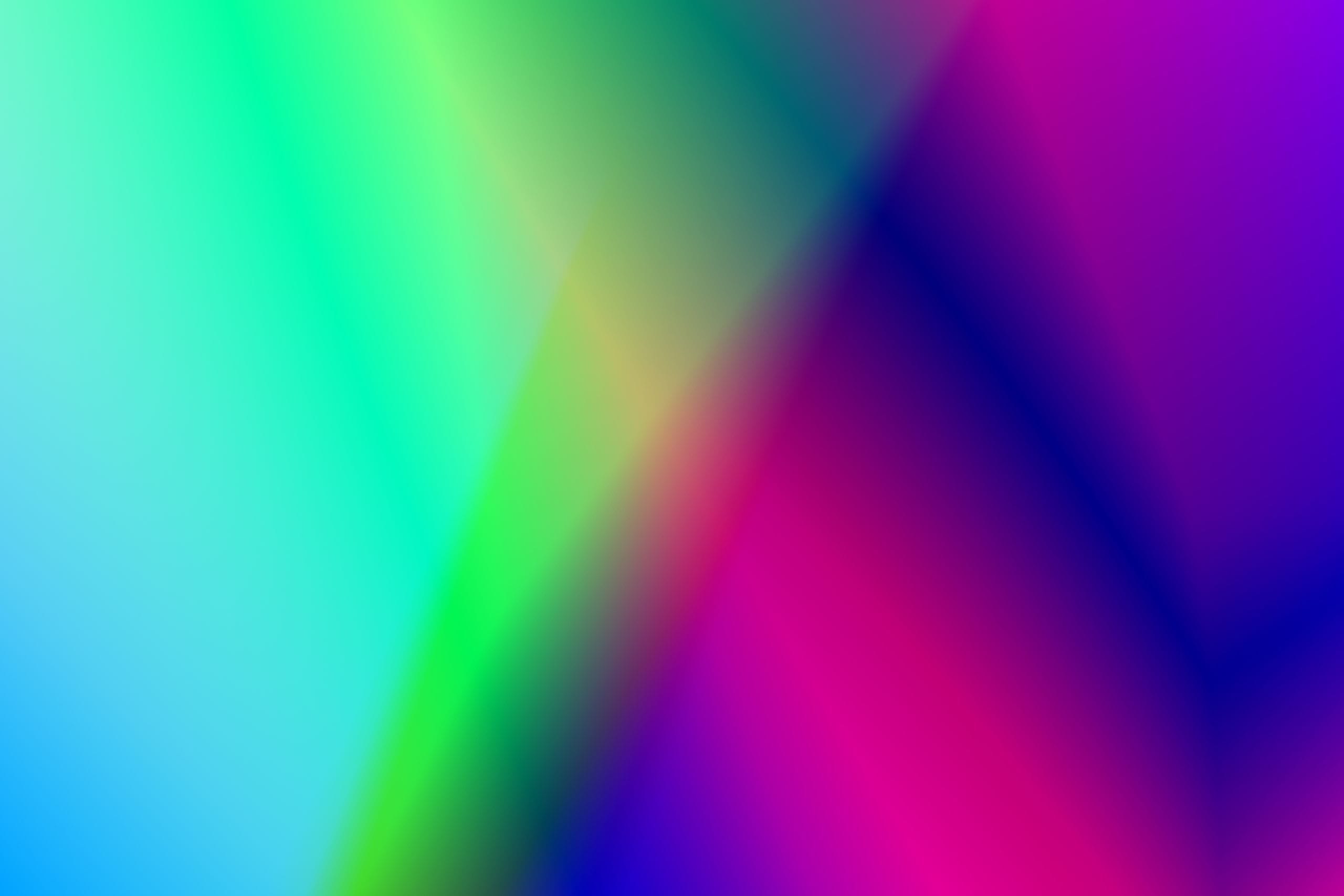 A dynamic and vibrant abstract gradient with blue, green, pink, and pu