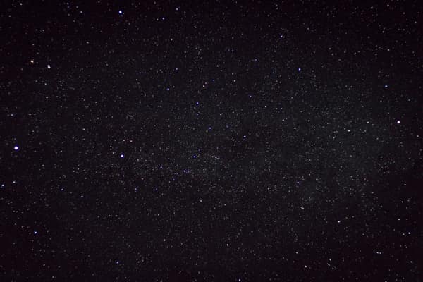 A clear starry night sky captured over the countryside in Germany, sho