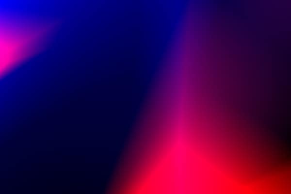A vibrant abstract background featuring a blend of blue and red color 
