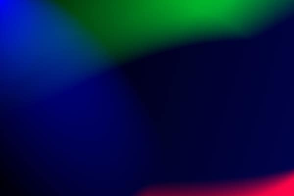 Vivid abstract gradient background with blue, green, and red hues. Ide