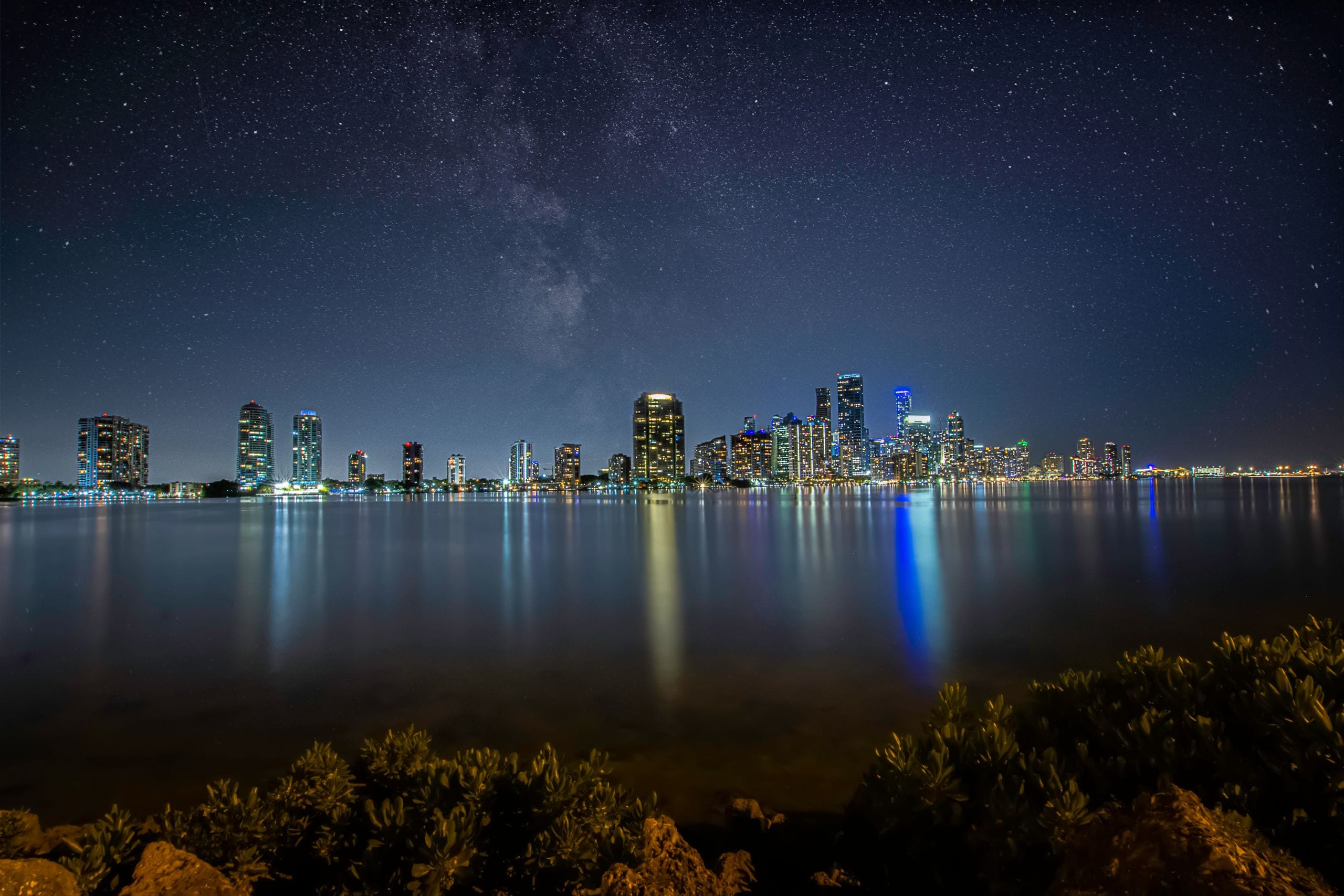 Breathtaking view of Miami's skyline at night with a star-filled sky r